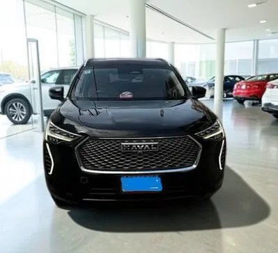 The same SUV, unchanged, inside a bright car showroom made by AI