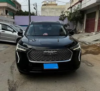 A black SUV parked on a residential street